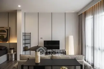 Modern living room with sleek design and large windows for natural light
