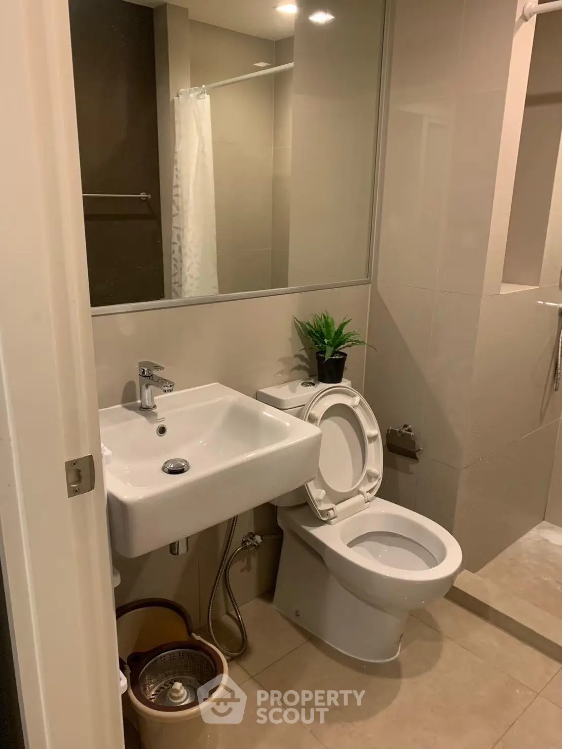Modern bathroom with sleek fixtures and neutral tones, perfect for a contemporary home.