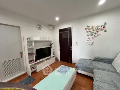 Cozy living room with modern decor and butterfly wall art