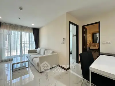 Modern living room with sleek furniture and large windows in a stylish apartment.