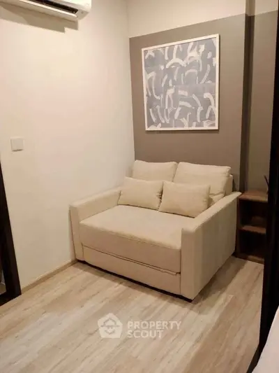 Cozy small living room with modern decor and comfortable seating