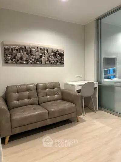 Modern living room with stylish sofa and study desk, perfect for urban living.