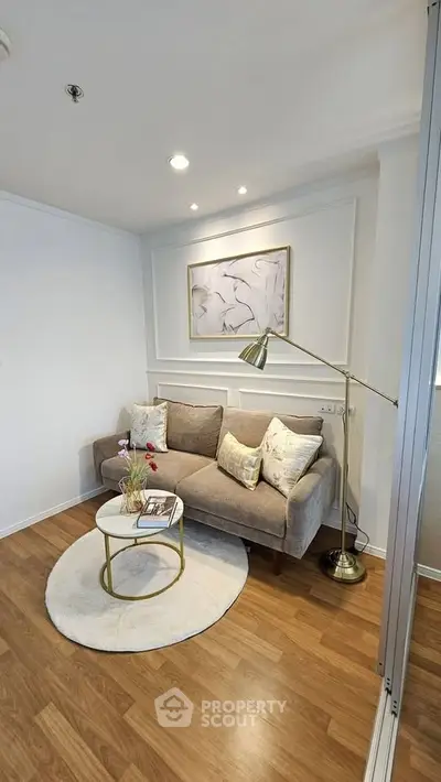 Cozy living room with stylish decor and elegant lighting, perfect for relaxation and entertaining.