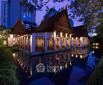 Stunning traditional architecture with serene water reflection at dusk