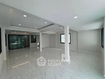 Spacious modern living room with sleek design and ample natural light
