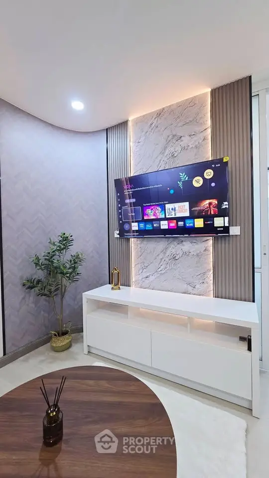 Modern living room with stylish TV setup and elegant decor