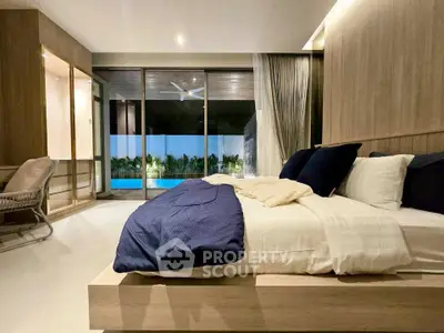 Luxurious bedroom with pool view and modern decor