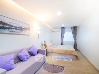 Spacious bedroom with modern decor and cozy ambiance