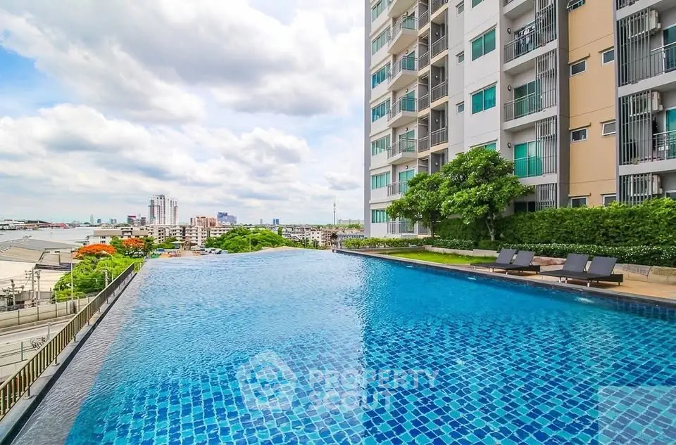 Luxurious high-rise building with stunning infinity pool and city view