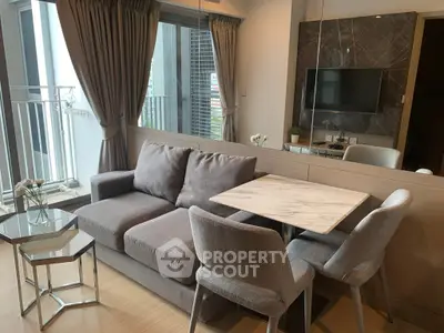 Modern living room with stylish furniture and balcony view