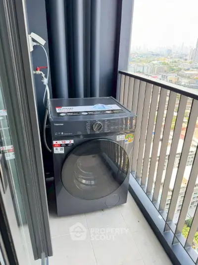 Modern balcony with washing machine and city view, perfect for urban living convenience.