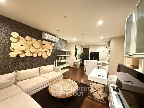Luxurious living room with modern decor and cozy seating in upscale apartment