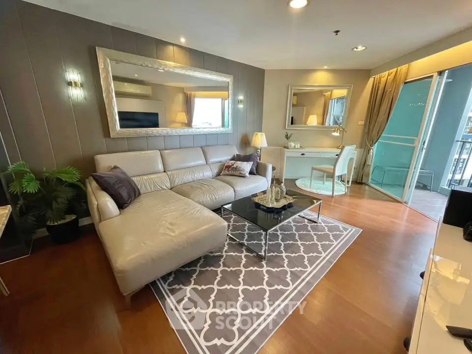 Luxurious living room with elegant decor and spacious balcony access.