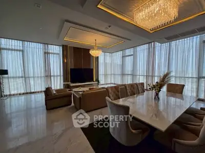 Luxurious living room with elegant chandeliers and panoramic windows