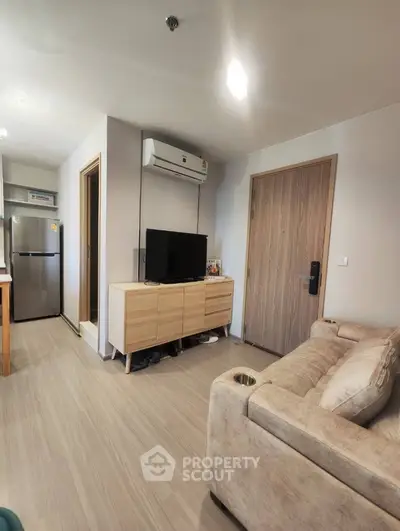Modern living room with stylish furniture and air conditioning in a cozy apartment.