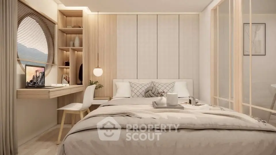 Modern bedroom with stylish decor and natural light, featuring a cozy workspace and elegant furnishings.