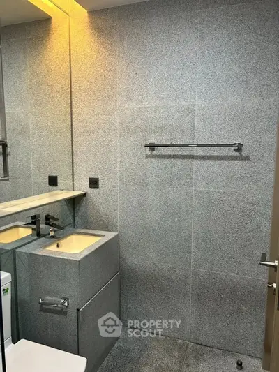 Modern bathroom with sleek gray tiles and contemporary fixtures