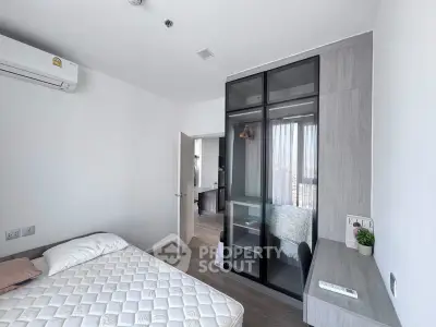 Modern bedroom with sleek wardrobe and cozy decor