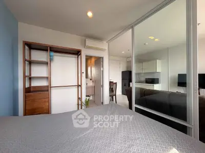 Modern bedroom with open layout and glass partition in stylish apartment