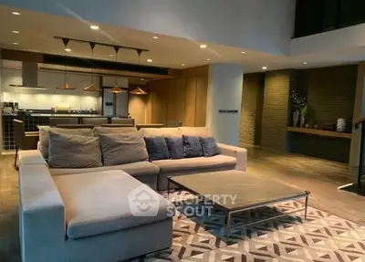 Luxurious modern living room with open kitchen and stylish decor