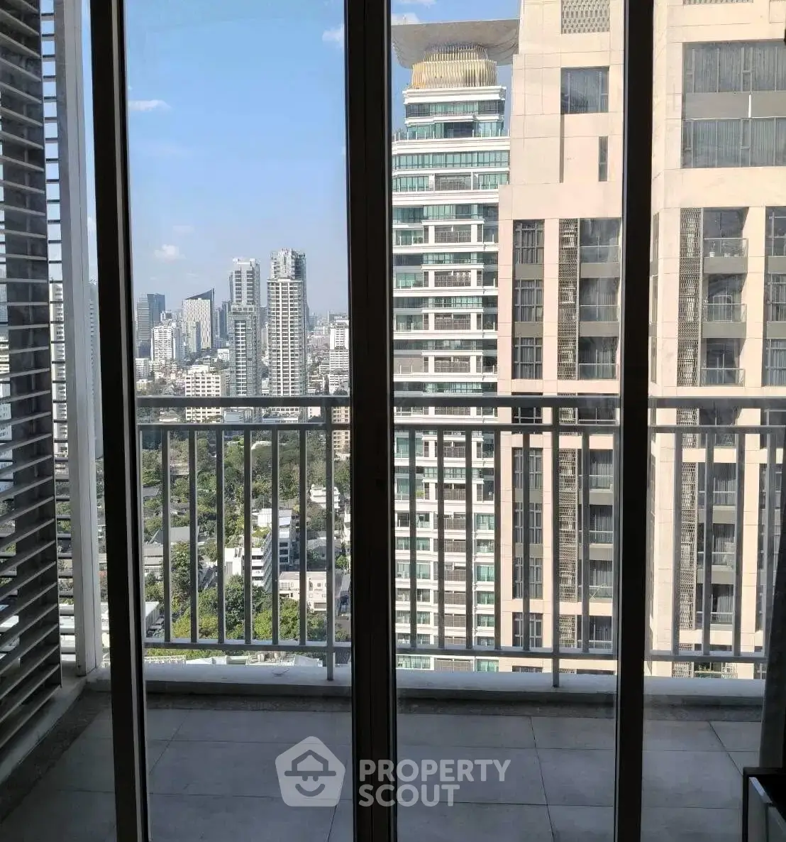 Stunning cityscape view from a high-rise balcony, perfect for urban living enthusiasts.