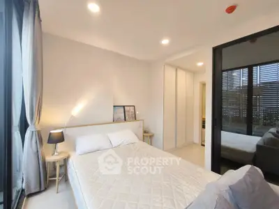 Modern bedroom with large window and minimalist decor