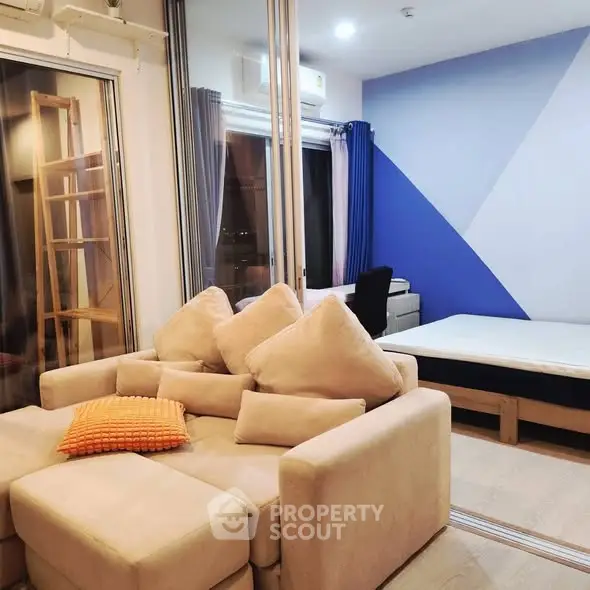 Modern living room with stylish decor and cozy seating in a contemporary apartment.