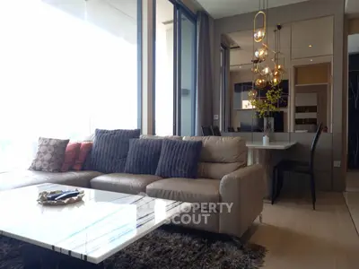Luxurious modern living room with elegant decor and large windows