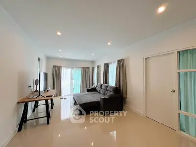 Spacious modern living room with sleek furniture and natural light