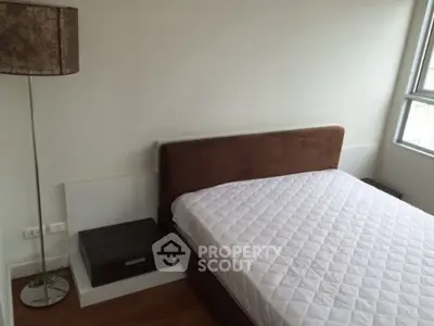 Cozy bedroom with modern decor and natural light