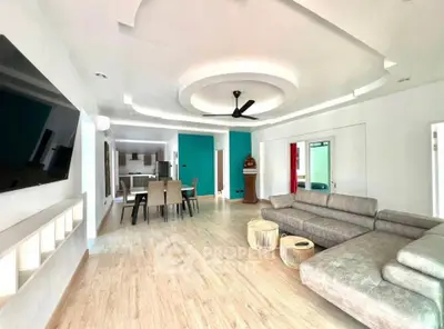 Spacious modern living room with stylish ceiling design and open layout