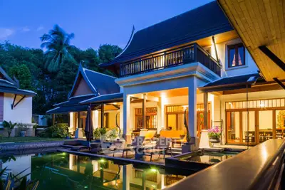 Luxurious tropical villa with pool and elegant architecture at dusk