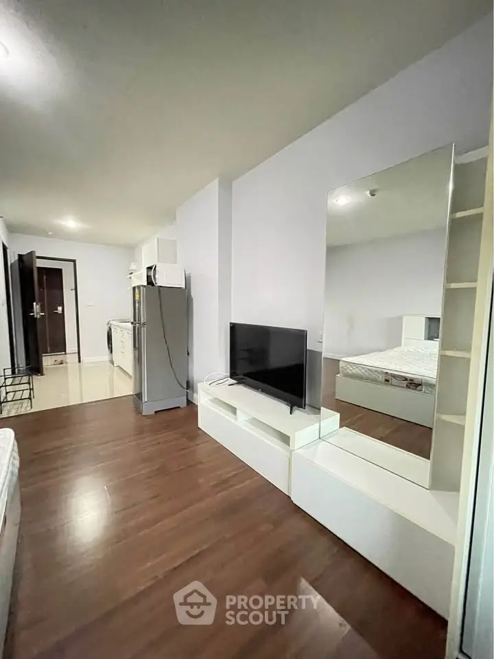 Modern studio apartment with sleek design and hardwood floors