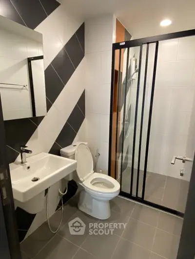 Modern bathroom with sleek design and glass shower enclosure