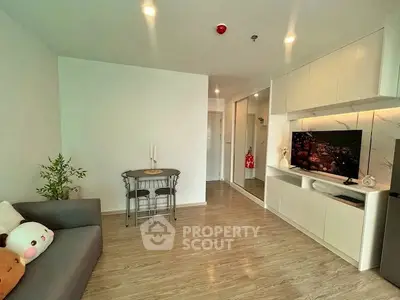 Modern living room with sleek built-in entertainment unit and cozy seating area.