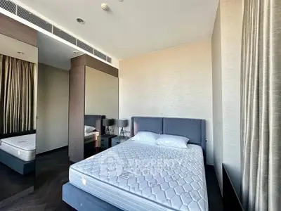 Modern bedroom with stylish decor and large mirror