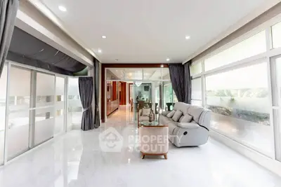 Luxurious living room with elegant decor and large windows for natural light