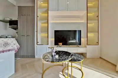 Modern living room with stylish TV unit and elegant marble coffee tables