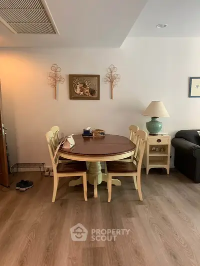 Charming dining area with wooden table and decor in cozy living space