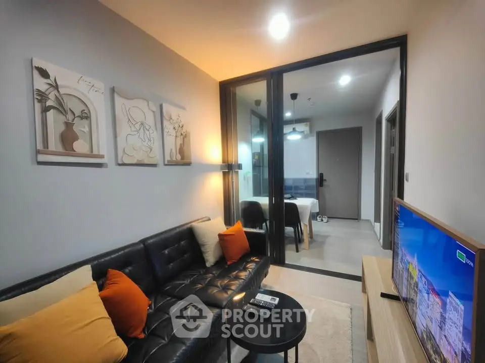 Modern living room with stylish decor and open view to dining area