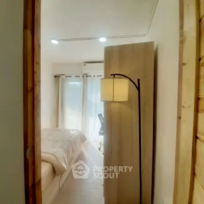 Cozy bedroom with natural light and modern decor