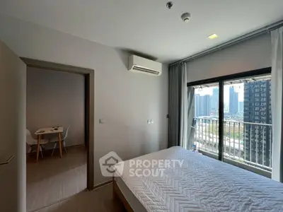 Modern bedroom with balcony view in high-rise apartment