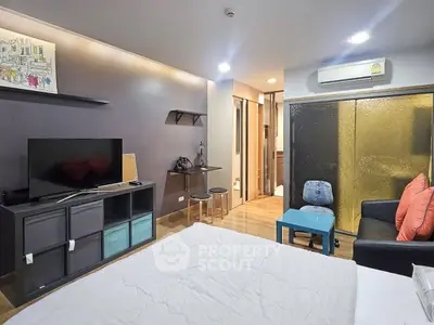 Modern studio apartment with cozy living area and stylish decor