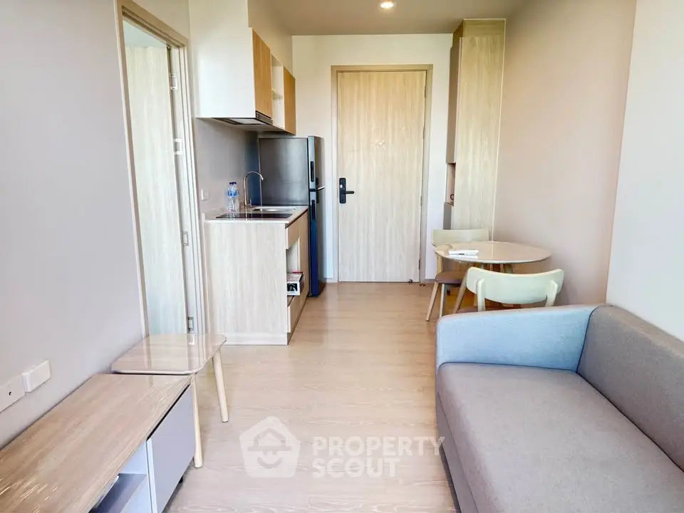 Modern compact living room with open kitchen in minimalist apartment