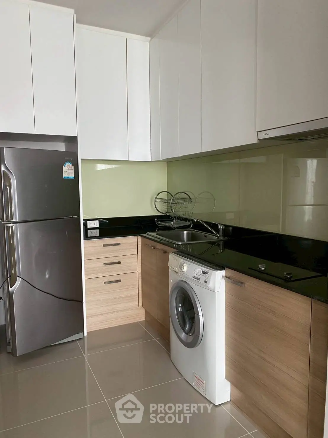 Modern kitchen with sleek cabinets and built-in appliances