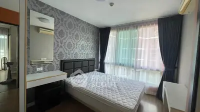 Modern bedroom with stylish wallpaper and large window in a contemporary apartment.