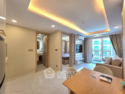 Modern open-plan living room with elegant lighting and balcony view