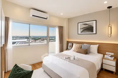 Modern bedroom with large window and stylish decor, offering a cozy and inviting atmosphere.