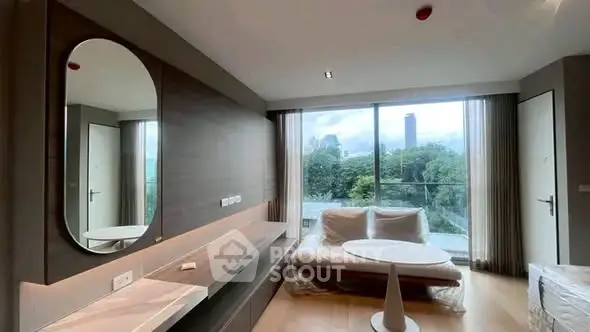 Modern living room with large window offering stunning cityscape view and elegant furnishings.
