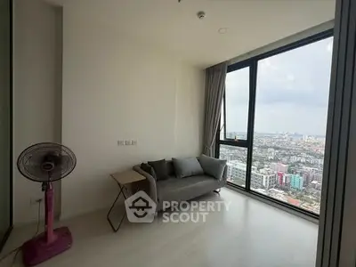 Modern living room with panoramic city view and minimalist decor